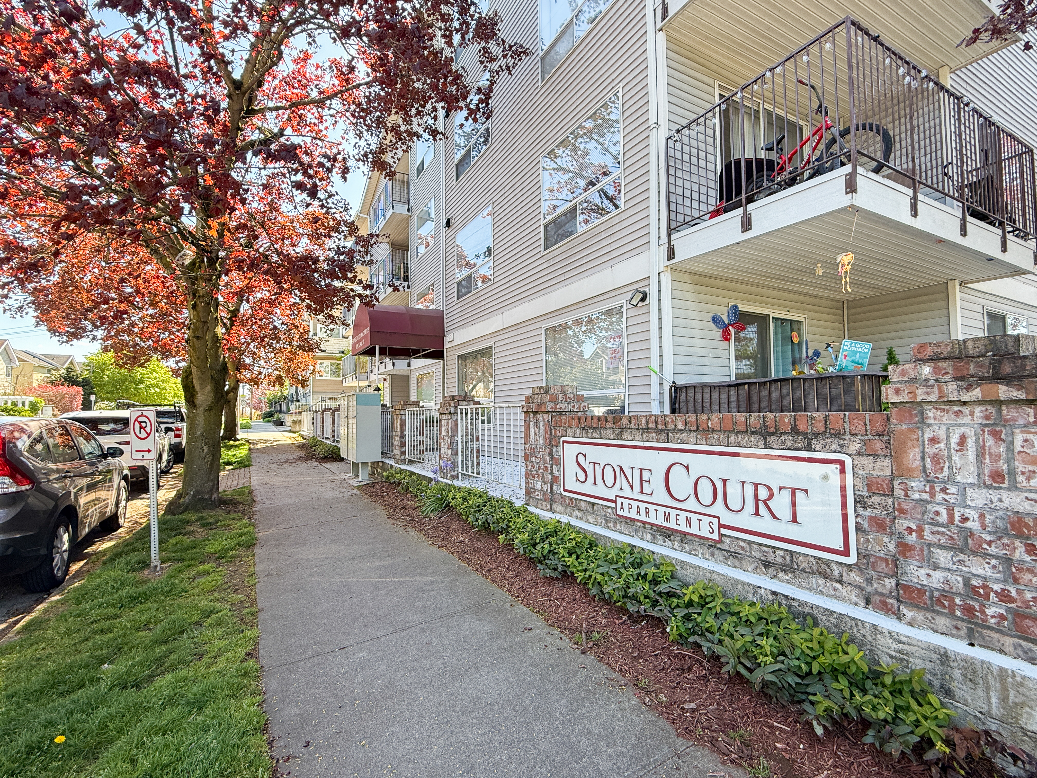 Seattle WA residential street with rental homes and apartments, professionally managed by Sagareus